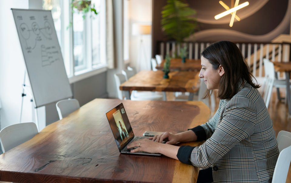 A Salesperson Working in an Office on a Virtual Call