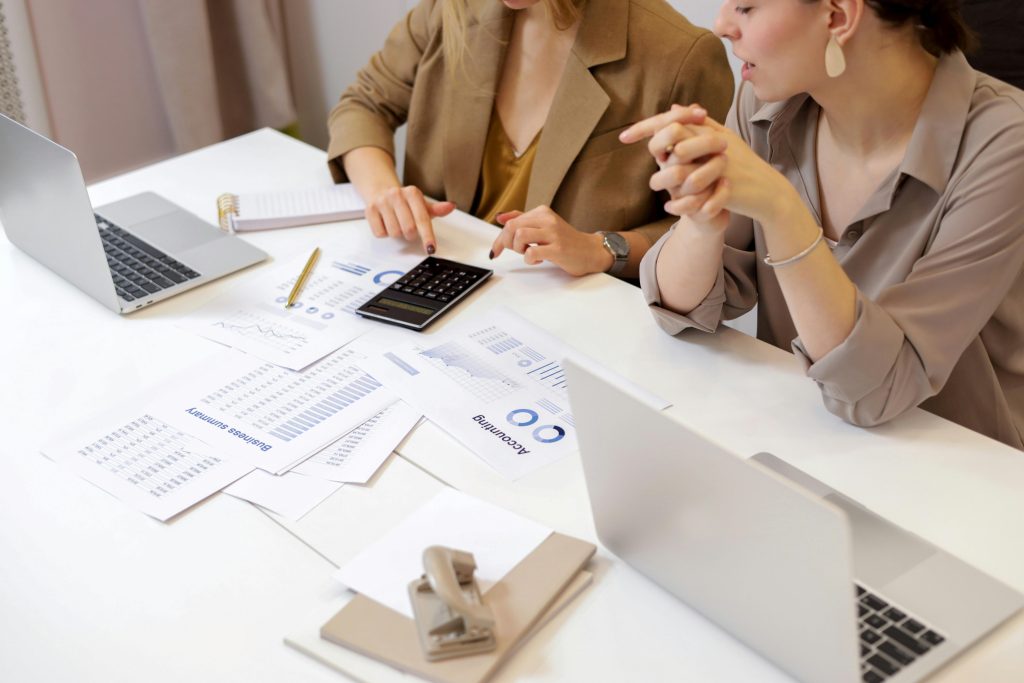 Two Women Working on Accounting Documents